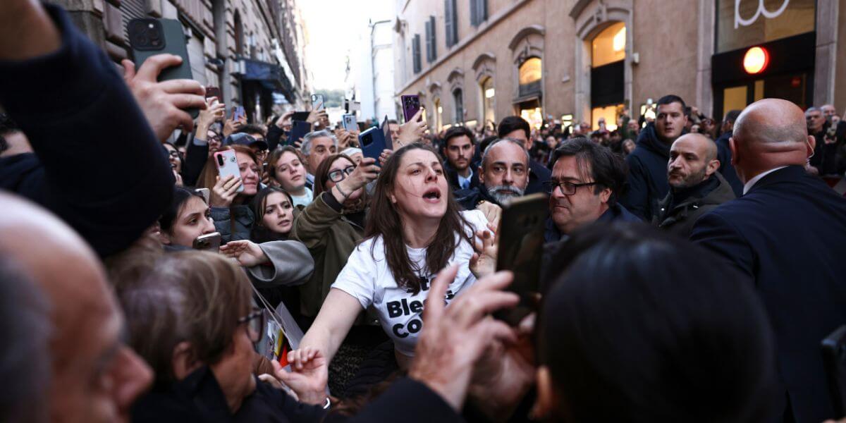 A person yelling in a crowd