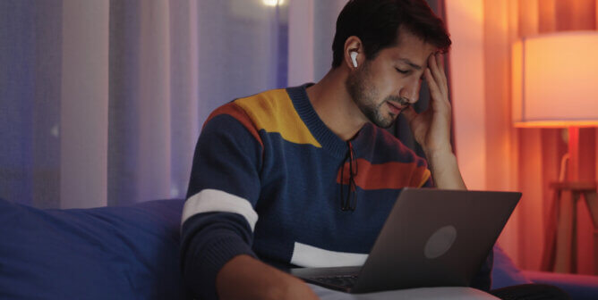 Man reading negative content online