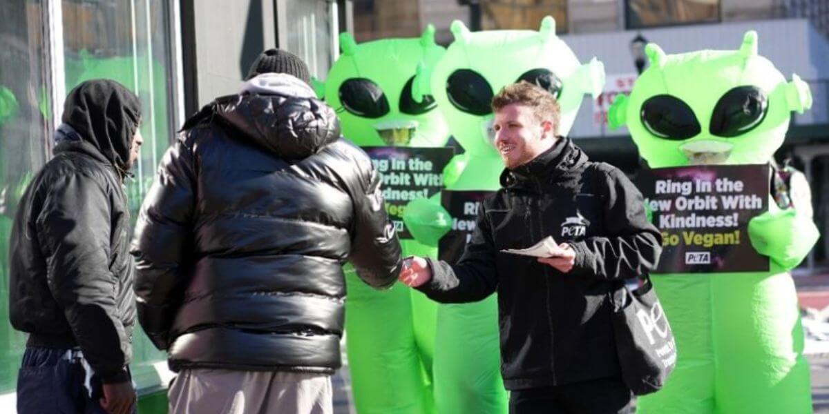 Man handing out leaflets at demo