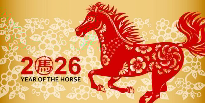 Red colored paper cut horse on a floral background, the Chinese stamp means horse