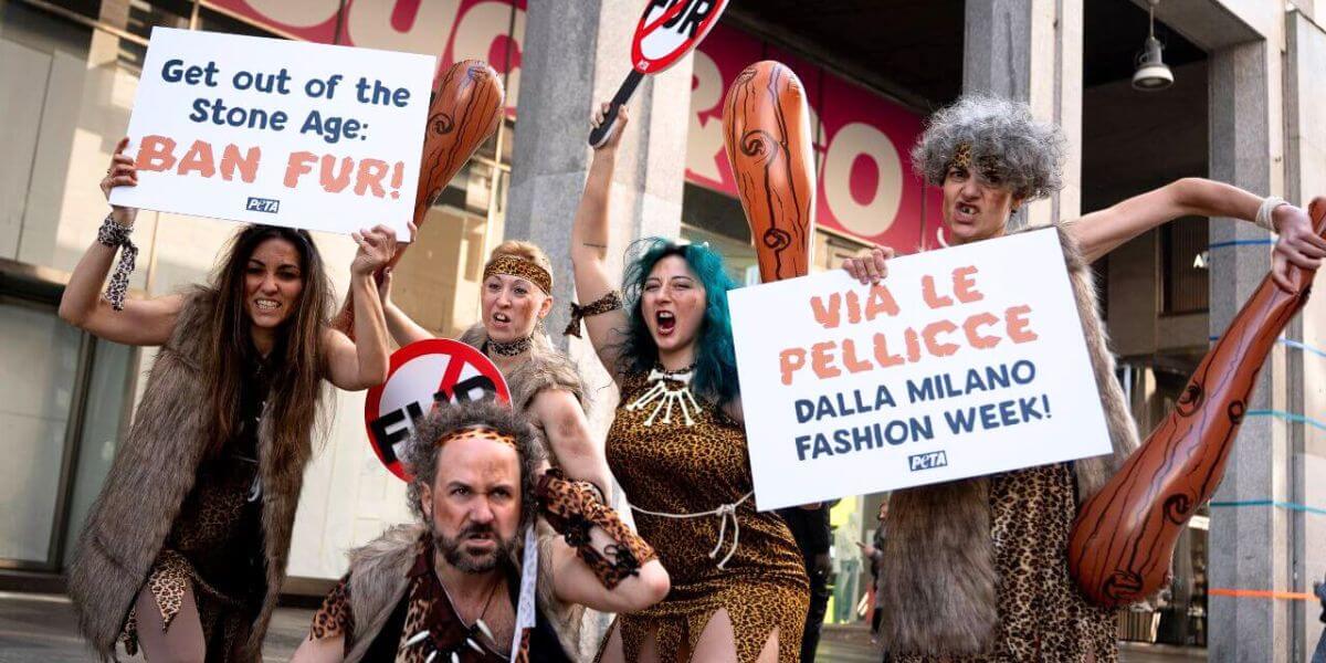 A group of people in Cavepeople clothes