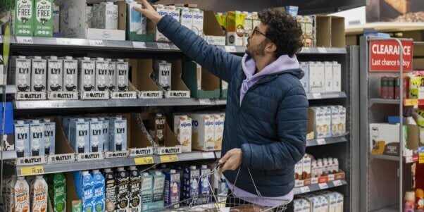 Man buying vegan milk