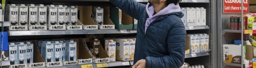 Man buying vegan milk