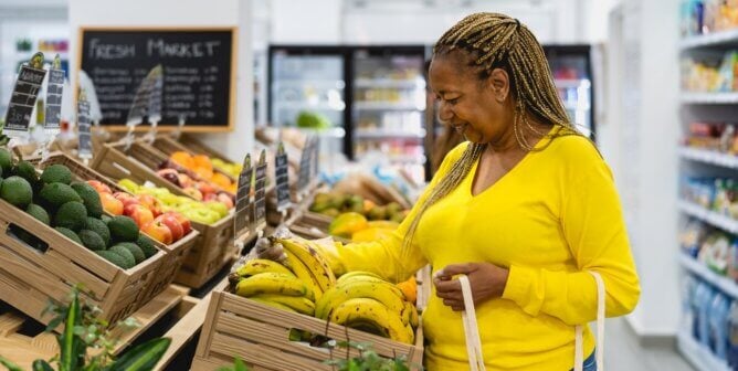 Woman shopping for fresh fruit