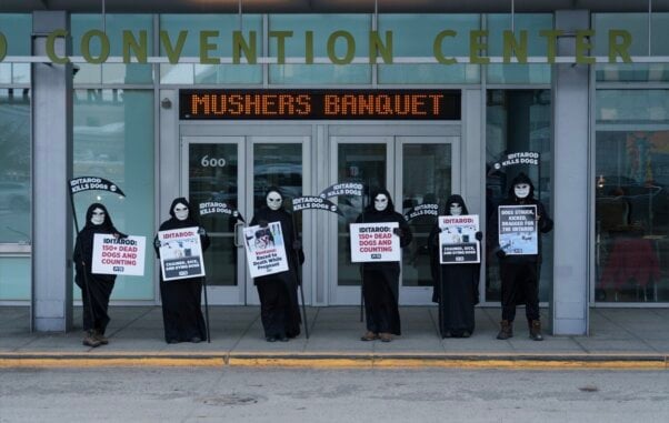 Reapers standing in a line in front of the mushers banquet
