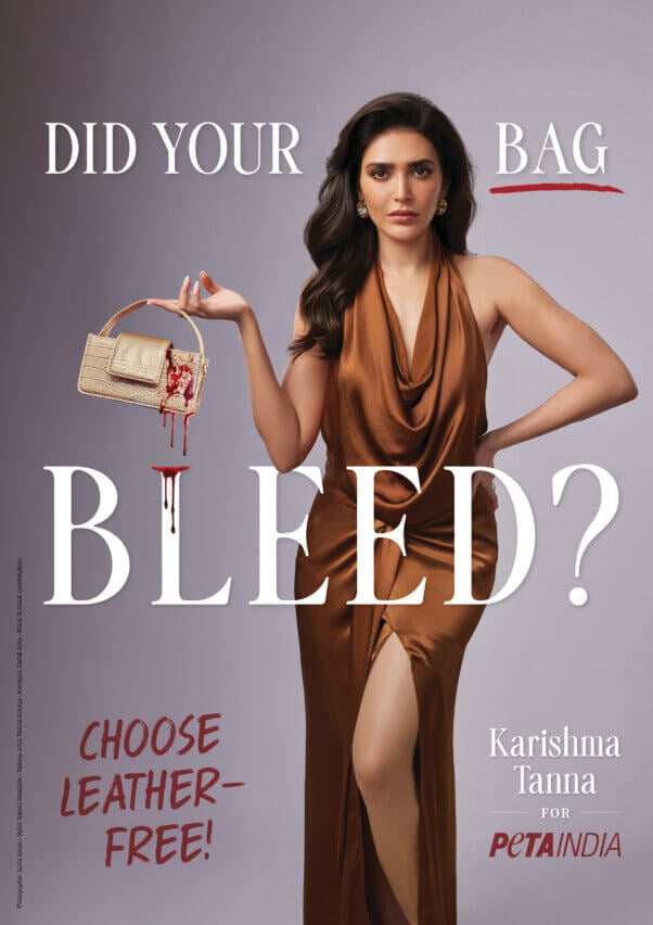 karishma tanna wearing a brown gown and holding a bloody purse in an anti-leather ad for peta india