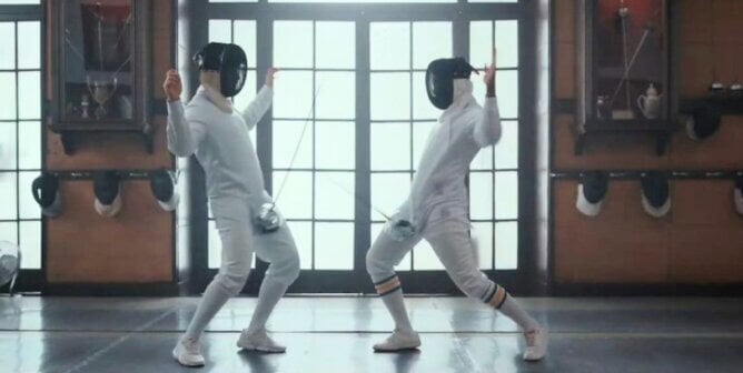 Two men fencing