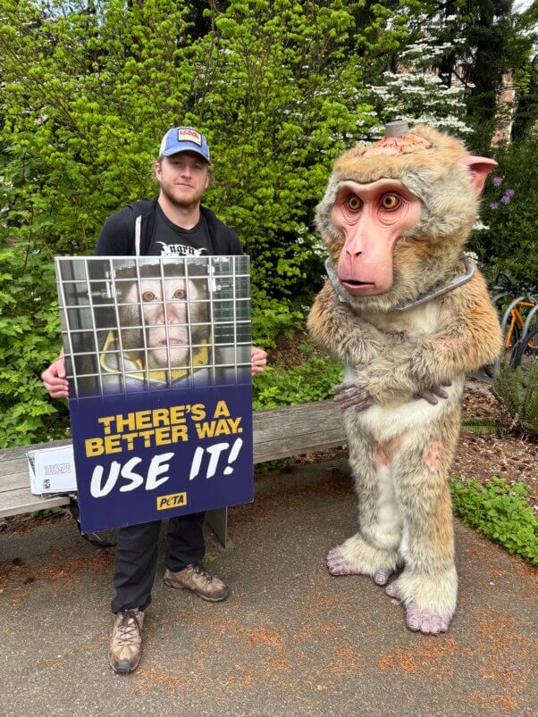 Dorothy next to a demonstrator with a sign