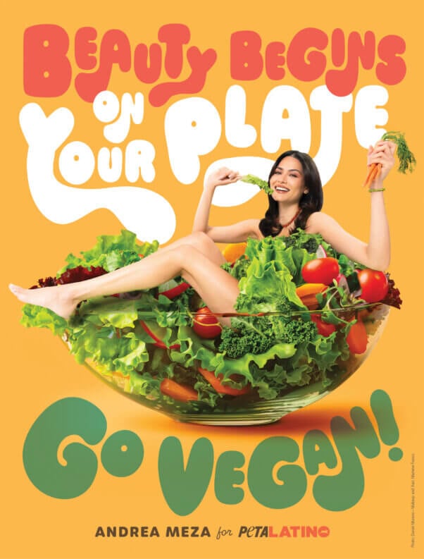 2020 Miss Universe Andrea Meza poses in a giant salad bowl in a PETA Latino ad reading, "Beauty Begins on Your Plate. Go Vegan!"