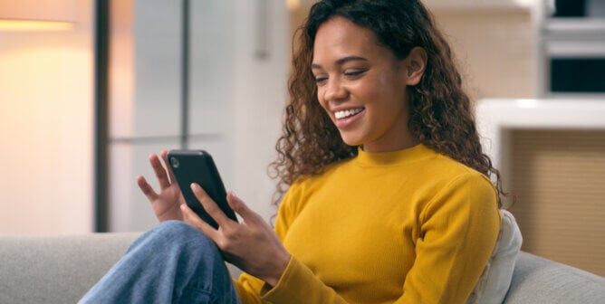 young woman scrolling on smartphone