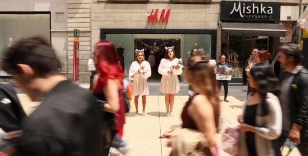 PETA Latino activists hold bloodied "lambs" outside an H&M in Mexico City.