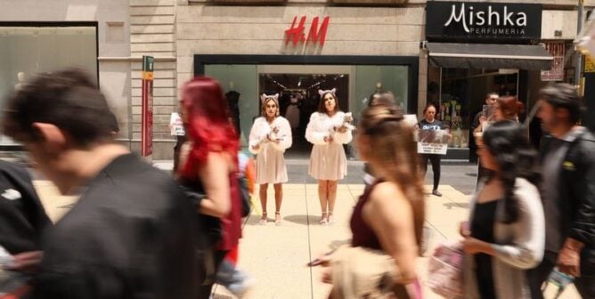 PETA Latino activists hold bloodied "lambs" outside an H&M in Mexico City.