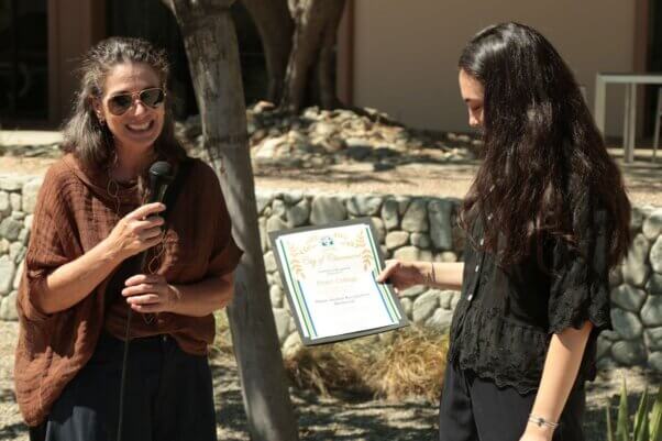 Claremont Mayor Jennifer Stark presents PETA with a certificate.