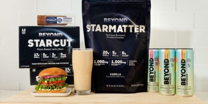 A promotional photo from Beyond showing Beyond Immerse protein drinks, Beyond Starmatter protein powder, and Beyond Starcut jerky bars.
