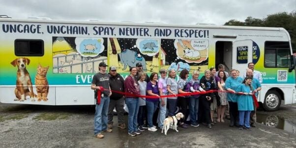 Ribbon-cutting ceremony for the mobile clinic PETA donated to the Twin County Humane Society