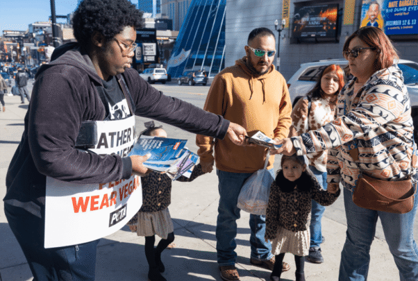 A PETA supporter passed out fliers at a “Free the Animals” Friday protest in Nashville, TN.